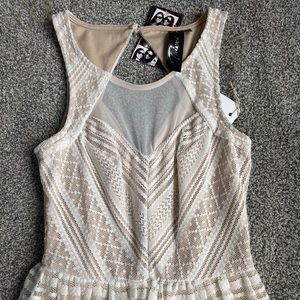 Sleeveless lace dress.